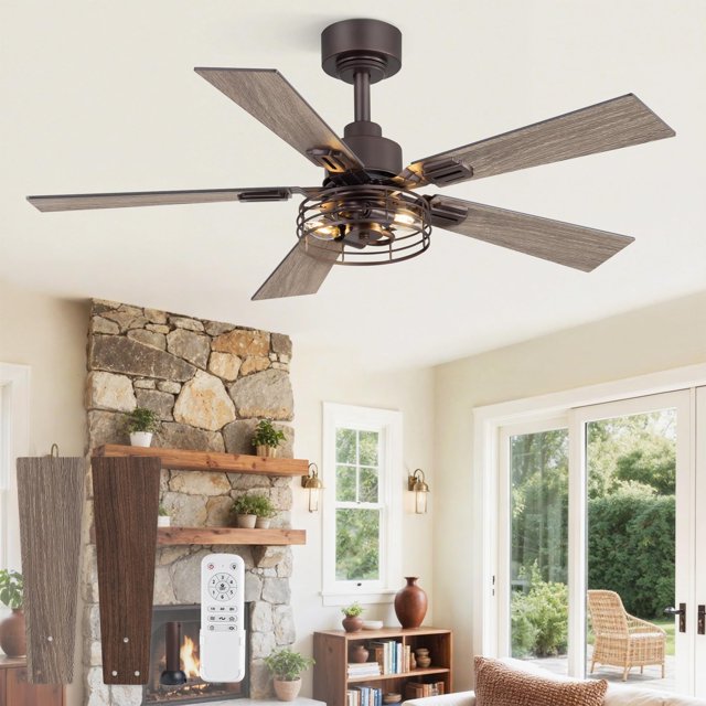 Ventilador de Techo Estilo Granja Fanbulous de 42" con Aspas Doble Cara frontal centrado; jaula metálica con luz expuesta y motor en bronce oscuro, 5 aspas dobles rústicas en bronce envejecido y acabado madera clara, control remoto y dos juegos de aspas opcionales visibles en primer plano; ambientado en sala luminosa con chimenea de piedra y puertas corredizas de vidrio, ideal para sala y dormitorio y también apto para oficina en casa.