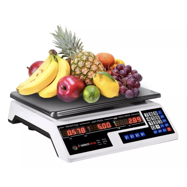 báscula comercial digital lcd 40 kg recargable tecla tara blanca, vista frontal 3/4 con plato de acero inoxidable cargado con frutas; pantalla LED que muestra peso y precio, teclado ABS de 24 teclas a la derecha, botón de encendido y burbuja de nivelación en el panel. Según especificaciones incluye rango 5 g–40 kg, batería recargable, función TARA y base antiderrapante; también es adecuada para pesar ingredientes en puestos de venta ambulante.