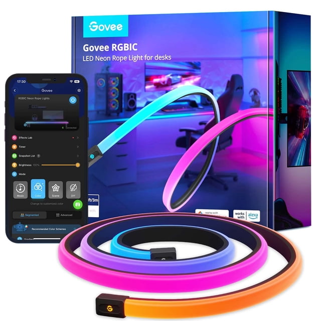 luces de juego govee rgbic neon rope de 3 m con razer chroma sync multicolor, tira de neón enrollada en primer plano con segmentos RGBIC visibles en azul, rosa y naranja; caja del producto y pantalla de la app Govee Home al fondo que indican control por Wi‑Fi 2.4 GHz y sincronización con Razer Chroma; adecuada para escritorios de juego y suele usarse también para retroiluminar monitores.