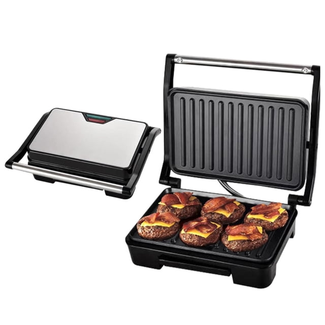 panini press macarena parrilla eléctrica para interiores 750w sandwichera — Vista 3/4 con unidad abierta y otra cerrada; prensa negra Macarena con placas acanaladas antiadherentes de acero inoxidable, mango anti‑escaldado y luz indicadora frontal, superficie de cocción 27 x 22 cm (11 x 9 pulg.), tapa con acabado metálico y bandeja mostrando porciones como ejemplo; ideal para sándwiches y a menudo usada también para calentar bocados y tapas en reuniones.