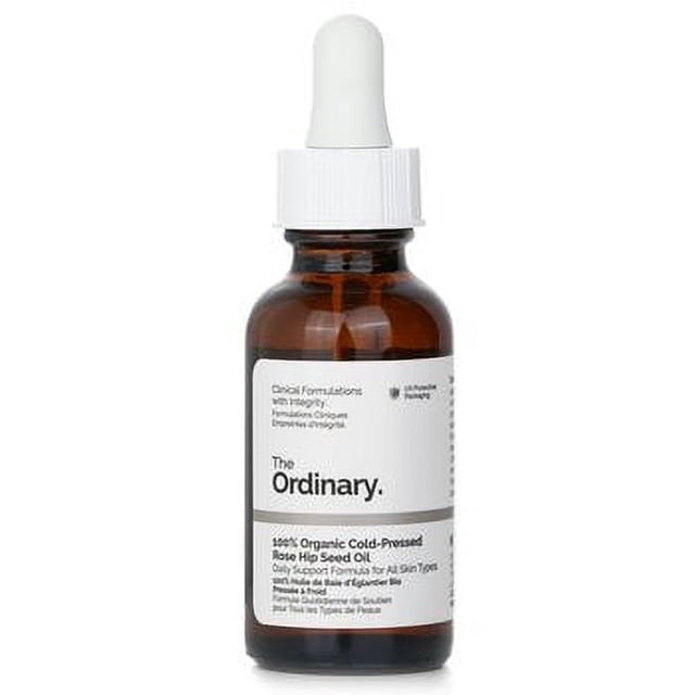 aceite de semilla de rosa mosqueta 100% orgánico prensado en frío the ordinary botella ámbar con cuentagotas blanco en vista frontal, etiqueta blanca con logotipo The Ordinary y texto que indica fórmula prensada en frío; indicado para uso diario y a menudo usado como tratamiento facial para ayudar a hidratar y mejorar el tono de la piel.
