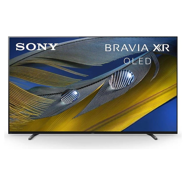 television sony 77" oled | 4k ultra hd con inteligencia cognitiva reacondicionado ( xr77a80cj) Reacondicionado — Televisor Sony Bravia XR OLED 77" en negro, vista frontal centrada con pantalla sin bordes metálicos y patas de apoyo; muestra imagen de plumas doradas y azules que resalta negros profundos y alto contraste; especificaciones indican sensor de luz y control por voz, ideal para cine en casa y uso con PlayStation.
