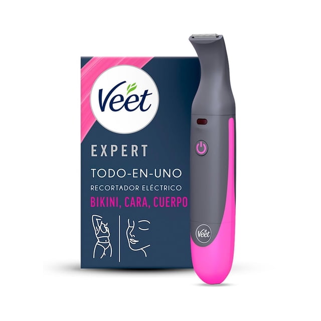 veet® expert recortador eléctrico todo en uno para mujer vista frontal centrada del empaque azul junto al recortador gris con base rosa; cuerpo ergonómico delgado con botón de encendido visible y cabezal de precisión para zona de bikini, cara y cejas; recargable por USB e 100% resistente al agua (IPX7) según especificaciones, incluye cabezales y bolsa de transporte, adecuado para retoques rápidos en viaje.