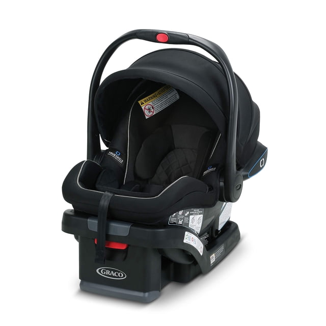 graco snugride snuglock 35 lx asiento infantil para automóvil, asiento para automóvil para bebé con tecnología de impacto lateral trueshield Vista frontal 3/4 de un asiento Graco SnugRide SnugLock 35 LX multicolor sobre su base; capota Silent Shade extendida, arnés frontal de 5 puntos, soporte acolchado para cabeza y cuerpo, mango ajustable con una mano y anclajes SnugLock visibles. Adecuado para bebés mirando hacia atrás de 4 a 35 lb (hasta 32"). A menudo usado también como asiento de transporte para paseos cortos fuera del auto.