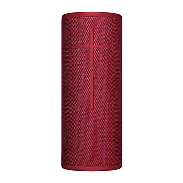 ultimate ears boom 3 wireless bluetooth speaker, sunset red — vista frontal centrada del altavoz cilíndrico en tela texturizada roja con símbolos grandes de volumen (+/−) en la rejilla; portátil y resistente, incluye botón mágico según ficha, sonido 360° y hasta 15 horas de batería, ideal para exteriores y viajes.