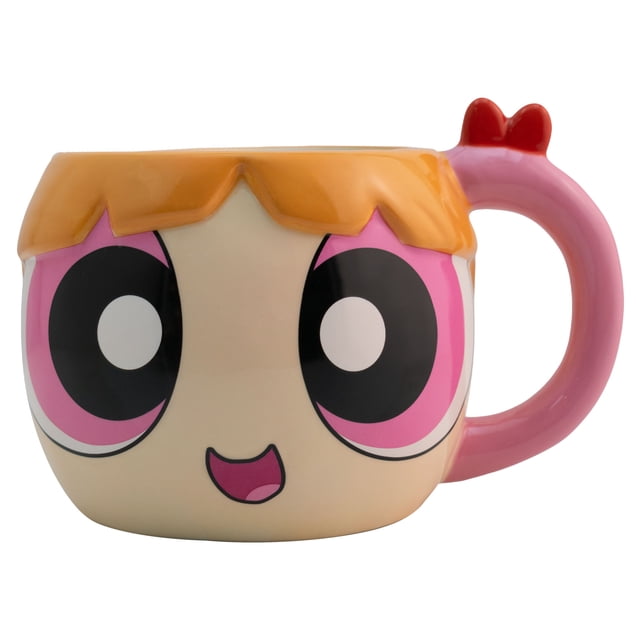 taza grande de cerámica, diseño esculpido en 3d, chicas super poderosas, modelo bombón, capacidad 591 mililitros Taza cerámica multicolor frontal que muestra la cabeza esculpida de Bombón con ojos grandes impresos, flequillo naranja en relieve y asa rosa con lazo rojo; altura 11 cm y diámetro 8 cm, acabado brillante; ideal para café o chocolate y a menudo usada como pieza de exhibición o colección.
