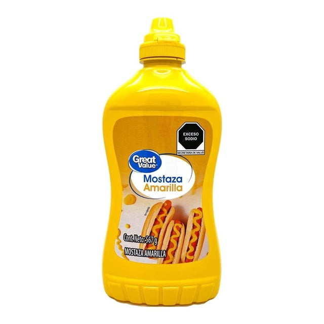 mostaza great value amarilla 567 g botella plástica amarilla centrada con boquilla exprimible; etiqueta con logo Great Value, texto "Mostaza Amarilla", fotografía de hot dogs y sello negro "Exceso sodio"; libre de gluten y hecha en Estados Unidos; también usada para aderezar ensaladas.