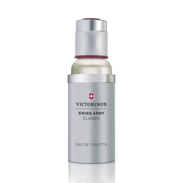 perfume victorinox swiss army classic eau de toilette 50 ml Frasco cilíndrico plateado de 50 ml con tapa texturizada plateada y borde rojo, logotipo rojo de Victorinox y texto 'Swiss Army Classic' en el frente; vista frontal sobre fondo blanco. Fragancia aromática amaderada, fresca y picante, recomendada para uso diario; el empaque puede variar. Tamaño compacto adecuado para viaje.