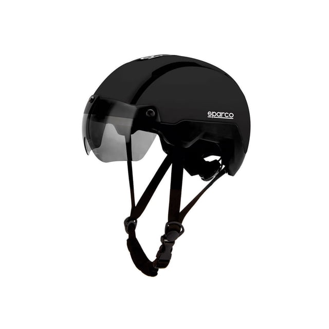 sparco casco bicicleta luz led trasera y visera magnética aerodinámica Casco Sparco negro, vista 3/4 con visera magnética transparente bajada, carcasa lisa de policarbonato, correas ajustables con hebilla y acolchado interior, soporte para luz LED trasera integrada y diseño aerodinámico; también apto como casco ligero para scooters urbanos.