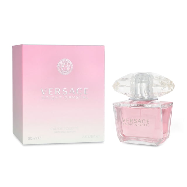 bright crystal 90 ml edt spray versace bright crystal multicolor botella y caja, toma frontal con botella de vidrio facetado cuadrada con líquido rosa pálido y tapa grande tipo gema transparente junto a caja degradada rosa a blanco con logotipo Versace; fragancia floral frutal para mujer, notas de yuzu, granada, flor de loto, magnolia, peonía y almizcle.