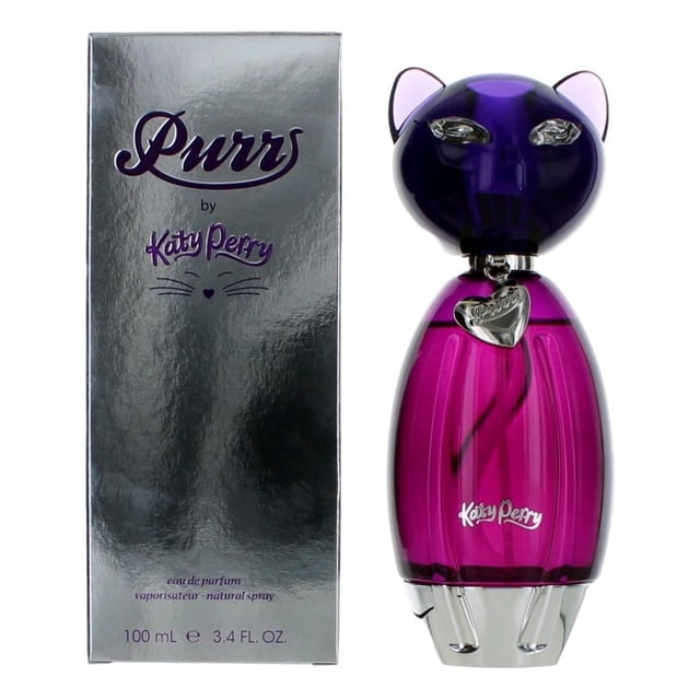 perfume katy perry purr eau de parfum, 100 ml, 100% auténtico — caja plateada brillante con texto "Purr by Katy Perry" a la izquierda; a la derecha frasco ovalado fucsia con tapa morada en forma de cabeza de gato, colgante pequeño en forma de corazón y base plateada, 100 ml (3.4 fl. oz.). A menudo se usa como regalo de ocasión.
