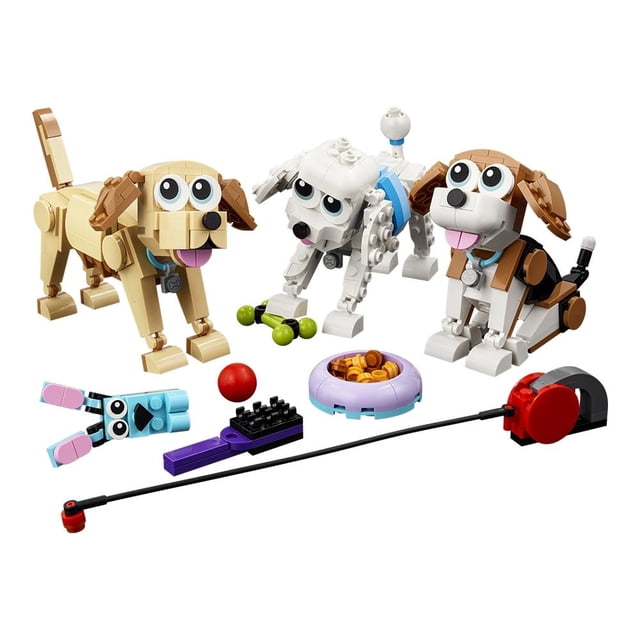 set lego creator canes adorables 31137 tres perros construibles en tonos blanco, beige y marrón con ojos grandes y piezas articuladas; incluye accesorios para jugar: pelota roja, comedero morado, hueso verde y correa con carrete; vista frontal sobre fondo blanco, recomendado para 7+ y compatible con LEGO Creator 3en1.