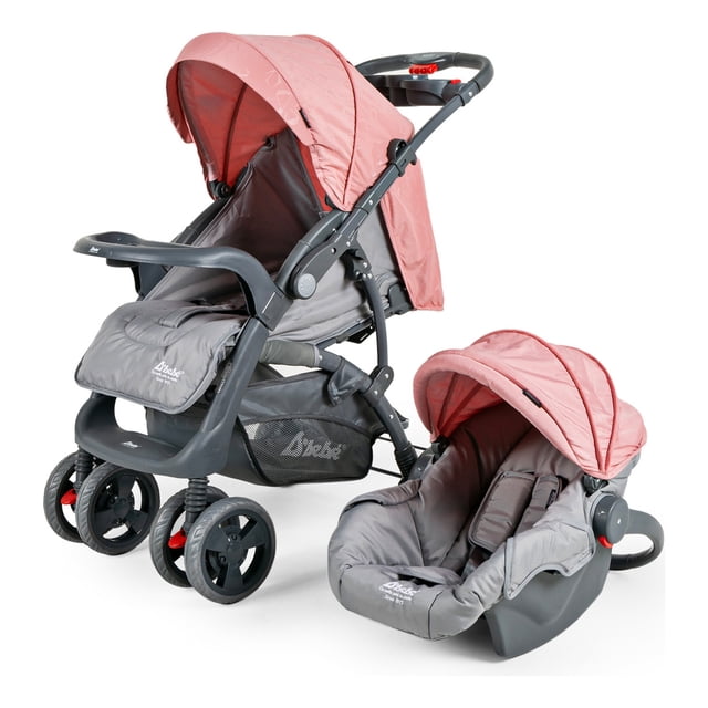 carriola para bebé y autoasiento d'bebé sistema de viaje elite reversible travel system con portabebé rosa, vista 3/4 frontal con capota rosa y chasis de acero gris; asiento principal con respaldo reclinable en 3 posiciones, baranda frontal y piecero elevable, canastilla con capacidad 4.5 kg, charola porta-biberones desmontable y manubrio con 2 portavasos; porta-bebé rosa desmontable que funciona como auto-asiento y balancín para 0–12 meses. Dimensiones 105×95×56 cm, peso 13 kg.