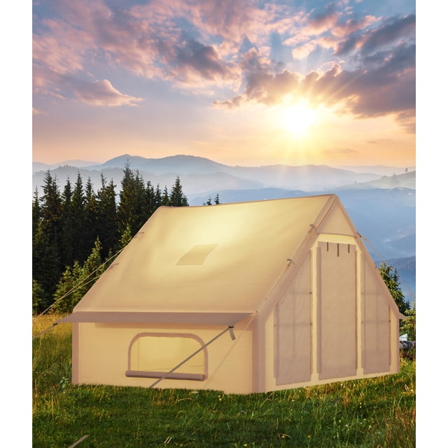 yeshouse tienda de campaña inflable para 6-8 personas caqui, montaje rápido con bomba incluida; 3/4 frontal de carpa tipo cabaña con techo alto y paredes rectas, gran puerta con solapa, ventana de malla y estacas visibles en pradera montañosa; espaciosa para camping y glamping y adecuada también para resguardar equipo.