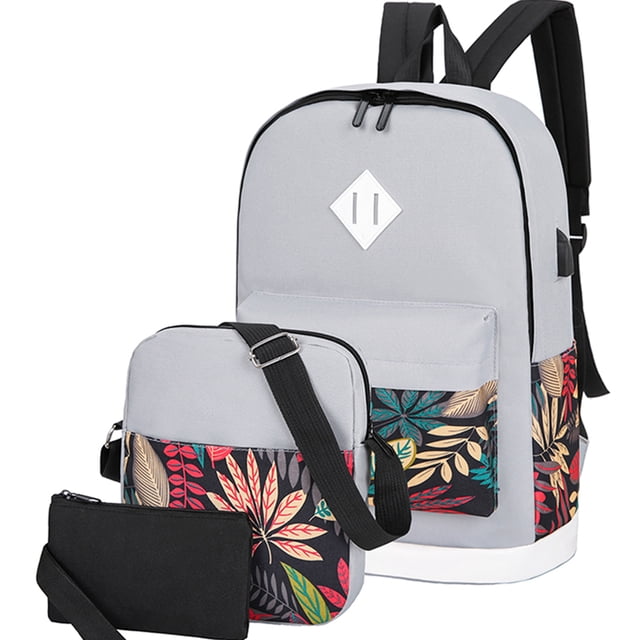 mochilas backpack shendy vendy impermeable puerto usb set 3pzs mochila gris con panel floral set de 3 piezas; vista frontal 3/4 de mochila grande, bolso cruzado y estuche, tela Oxford repelente al agua, tirantes y respaldo acolchados, bolsillo frontal con cremallera y puerto USB integrado; adecuada para laptop 15.6 pulgadas, estudiantes, oficina y viajes, no incluye power bank; también suele usarse para organizar material de dibujo o accesorios de viaje.