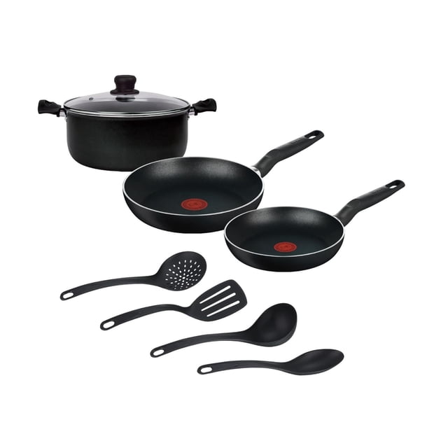 batería de cocina t-fal vital 8 piezas color negro modelo 5821100-negro frontal sobre fondo blanco: cacerola profunda con tapa de vidrio y mangos, dos sartenes con recubrimiento antiadherente y señal Thermo-Signal roja en el centro, y cuatro utensilios negros (espumadera, espátula ranurada, cucharón y cuchara). Acabado negro en aluminio con mangos ergonómicos y base Durabase visible; ideal para cocinar diario y también adecuada para preparar porciones pequeñas al viajar.