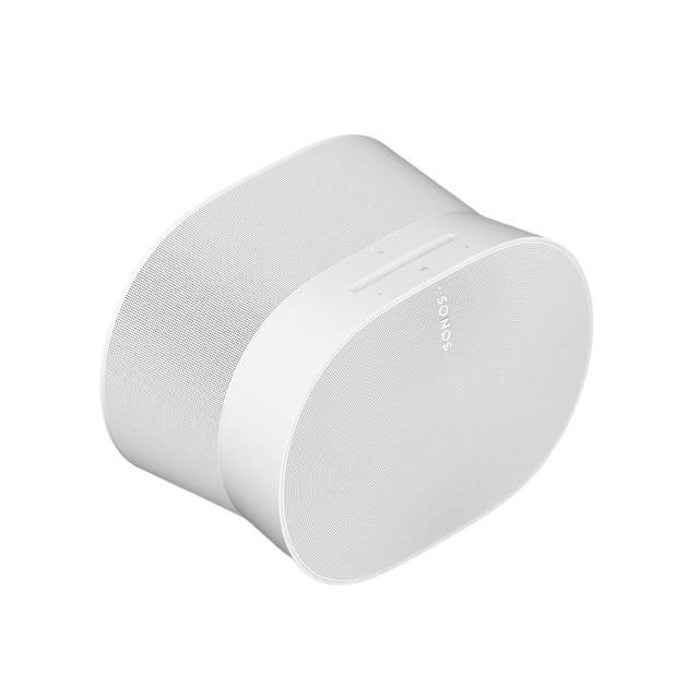 bocina inalámbrica, audio espacial wifi y bluetooth. sonos era 300 Blanco, vista 3/4 superior de la bocina con rejilla texturizada envolvente y franja lisa superior con botones táctiles y logo Sonos; silueta cilíndrica achatada que sugiere sonido multicanal y dispersión hacia los lados, adelante y arriba, conectividad Wi‑Fi, Bluetooth y entrada de 3.5 mm y ajuste Trueplay via app; adecuada también para ambientar espacios pequeños.