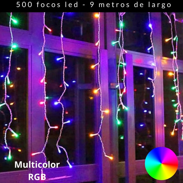 cascadas de luces led dosyu 9mts 500 luces multicolor — cortina de 9 m con 500 LED multicolor en hilos verticales y cable blanco flexible, luces rojas, azules, verdes y amarillas frente a una ventana; incluye 8 modos de iluminación y es apta para decoración navideña interior y exterior; a menudo usada para ambientar bodas y fiestas.