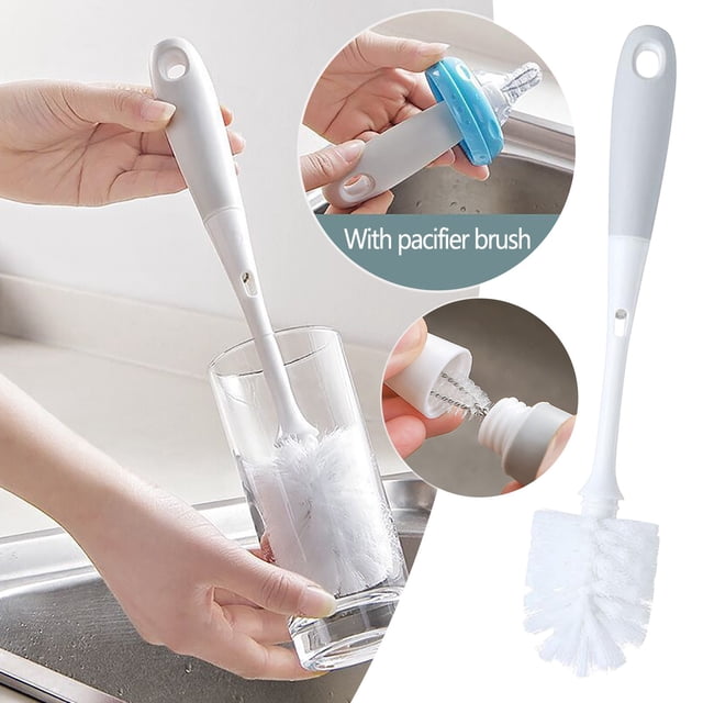 cepillo para vasos dos en uno con mango largo desmontable | cerdas de nailon resistentes | cepillo colgante para biberones, chupetes, ollas, teteras y utensilios de limpieza. Cepillo blanco con mango largo y orificio para colgar; cabezal cilíndrico de cerdas de nailon dentro de un vaso. Recuadros muestran la boquilla pequeña para limpiar chupetes y la unión desmontable del mango, apto también para limpiar teteras y utensilios estrechos.