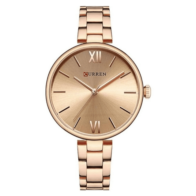 reloj curren kreb7120 oro rosa mujer cuarzo reloj Curren para mujer en acabado oro rosa, vista frontal centrada del dial redondo con XII y VI en números romanos, tres manecillas, caja y brazalete de eslabones de acero con acabado pulido y corona lateral sobre fondo blanco; apto también para vestir en eventos y uso diario.