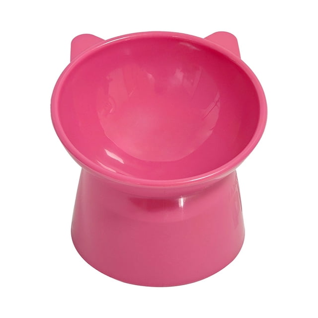 fancy pets. plato elevado de plástico para gato rosa Vista frontal centrada de un plato elevado rosa con base cónica y cuenco inclinado 45°; superficie brillante de plástico, orejas decorativas en el borde y altura elevada de 11.5 cm que evita que el gato se agache demasiado. Diseñado para mejorar la postura y la digestión de gatos adultos y senior; fácil de limpiar.