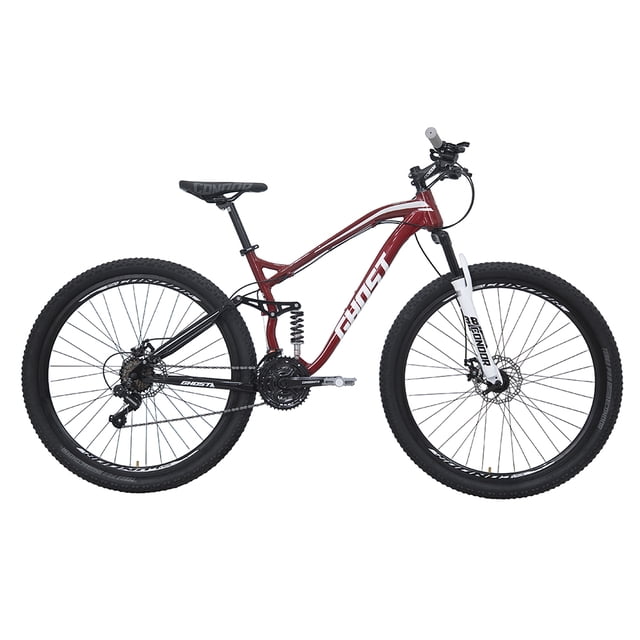 bicicleta ghost scrow rodada 29 rojo de montaña vista lateral centrada, cuadro suspensión rodado 29 en aluminio High Performance pintado rojo con logo GHOST en blanco, suspensión trasera con muelle visible y tijera frontal de suspensión en blanco, ruedas R29 con rines de aluminio doble pared y llantas 2.125"/2.30", transmisión triple 24x34x42T con rueda libre de 7 velocidades e indexado 7 velocidades en desviador trasero, frenos de disco delantero Ø160mm y trasero Ø140mm, manubrio acero Hi-Ten y palancas gatillo para 21 velocidades, sillín MTB adulto con poste de asiento acero Ø28.6; adecuada para ciclismo de montaña y frecuentemente usada para entrenamientos todoterreno.