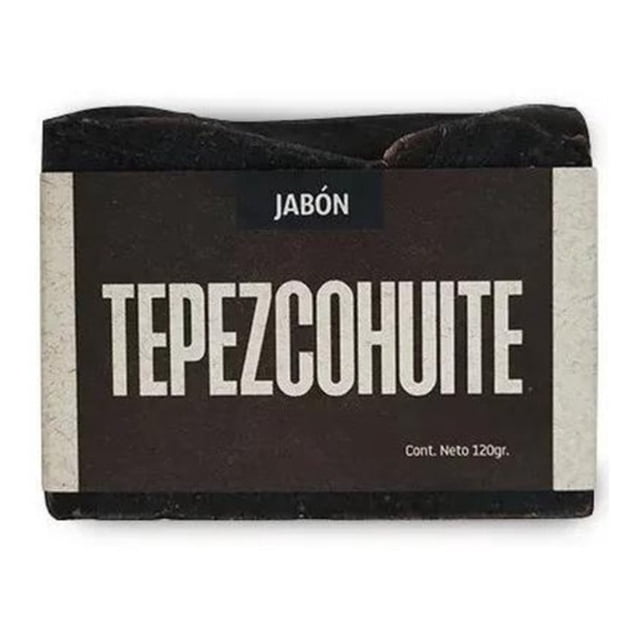 jabón tepezcohuite volviendo al origen 120g artesanal barra rectangular negra con etiqueta frontal marrón oscuro y texto blanco grande “TEPEZCOHUITE”, peso neto 120g y marca Volviendo al Origen; vista centrada en primer plano. Indicado para limpieza facial y control de impurezas; también suele utilizarse como jabón de manos en el hogar.
