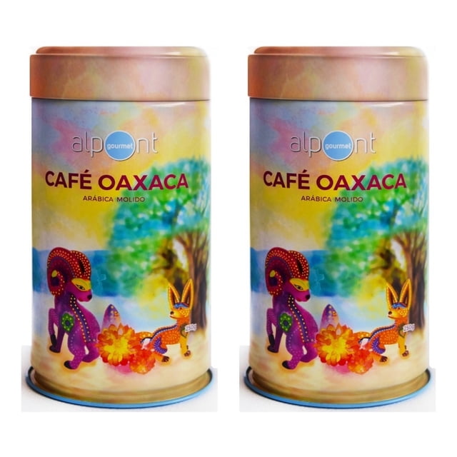 alpont gourmet café oaxaca molido 250 gramos 2 piezas dos latas frontales idénticas con etiqueta “CAFÉ OAXACA Arábica molido”, ilustraciones de alebrijes en fondo acuarela verde y amarillo, tapa rosada mate y base azul; cada lata contiene 250 g, a menudo usada como regalo gourmet o para despensa doméstica.