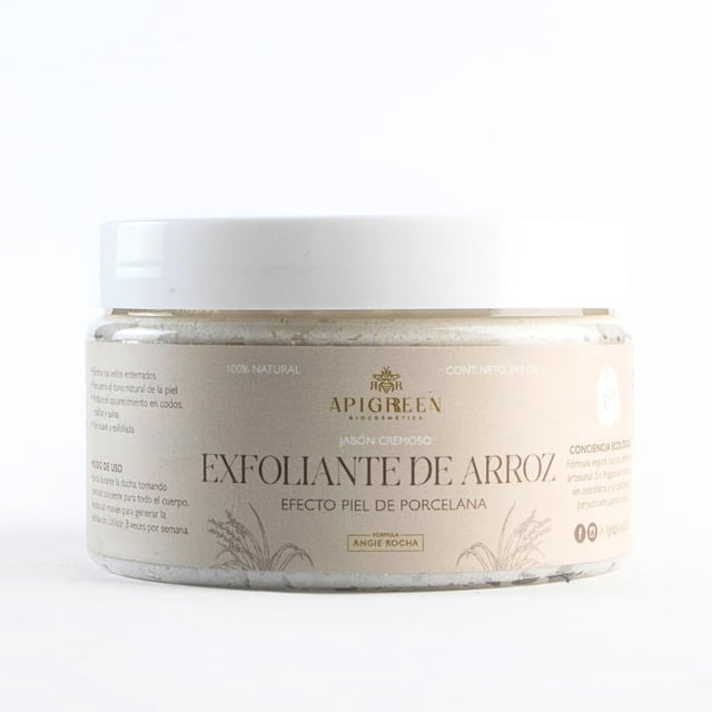 jabón exfoliante y aclarante de arroz apigreen 250 gr — tarro frontal centrado con tapa blanca y etiqueta beige que muestra la marca APIGREEN y el texto 'Exfoliante de Arroz'; presentación cremosa visible en el borde, indicado para uso diario en cara y cuerpo y para una exfoliación suave que renueva la piel; también suele usarse para preparar la piel antes de tratamientos cosméticos.