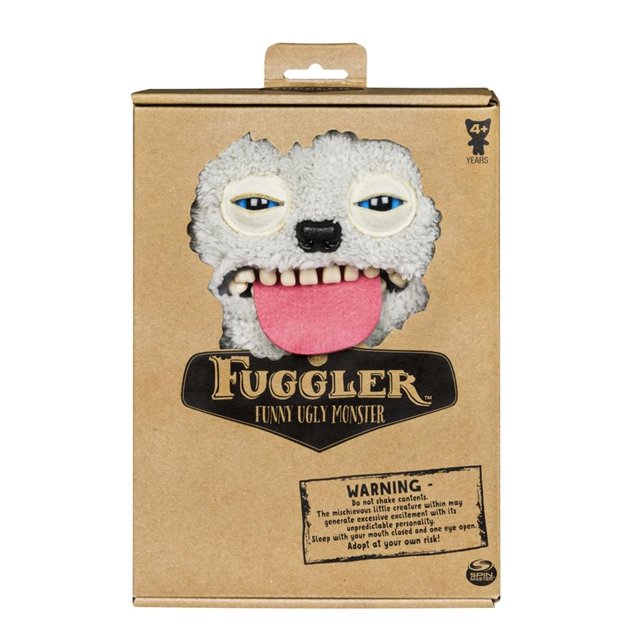 muñeco spin master fugglers 6043983 bi 24.4 cm Peluche Fuggler de 24.4 cm en empaque de cartón, vista frontal del rostro con fieltro gris texturizado, ojos azules entrecerrados, nariz negra, lengua rosa sobresaliendo y dientes espeluznantes visibles; marca Spin Master Games en la caja; recomendado 4+ años. Suele usarse como figura de colección o adorno en estantes de juguetes.
