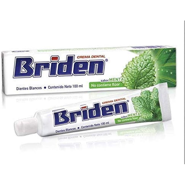 crema dental sin flúor briden caja 10 pz 100ml Caja con 10 tubos de crema dental sabor menta Briden en presentación de 100 ml; vista frontal con un tubo y su empaque rectangular blanco y azul, hoja de menta impresa y leyenda 'No contiene flúor', adecuada para higiene bucal diaria.