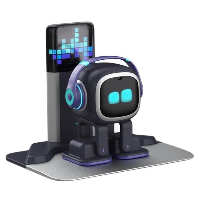 desk robot companion emopet emo ai chatgpt voice dance multicolor — Vista frontal centrada de EMO, robot de escritorio multicolor con pantalla facial negra que muestra dos ojos cuadrados azules, auriculares turquesa y morado integrados, cuerpo compacto con patas articuladas apoyado en estación de carga gris con base metálica y columna trasera con pantalla de píxeles; diseñado para interacción por voz, baile, chatGPT y juegos mediante app, ideal como juguete educativo y compañero de escritorio.