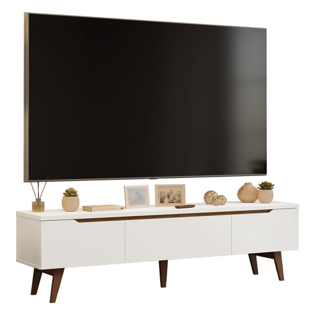 mueble mesa para tv madesa reims hasta 80' blanco vista frontal centrada de la mesa para TV Madesa Reims blanca para hasta 80" con patas de madera maciza marrón, tres frentes con dos puertas y un cajón con guías metálicas; superficie superior lisa con decoración y televisor; material MDP, 180 cm largo x 50 cm alto x 40 cm profundidad, pintura poliéster de 7 capas. También suele usarse como mueble de almacenamiento multimedia para consolas y equipos de audio.