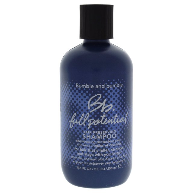 champú bumble and bumble con todo su potencial para preservar el cabello, 250 ml — botella azul marino frontal con tapa negra; etiqueta con patrón de puntos y texto blanco que indica 8.5 fl oz/250 ml, shampoo preservador que exfolia el cuero cabelludo y ayuda contra la caída por rotura; fondo blanco. Su tamaño compacto lo hace adecuado para llevar en viajes cortos.