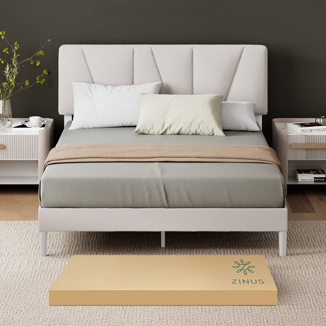 base de cama tapizada diseño asimétrico king size zinus maya fácil armado, vista frontal centrada de cabecera y base tapizadas color beige con paneles geométricos asimétricos; estructura de acero con listones de madera que eliminan la necesidad de sommier y ofrecen soporte uniforme; 17 cm de altura libre para almacenamiento; caja de envío ZINUS en primer plano; también adecuada como base compacta para almacenamiento temporal de ropa de cama.