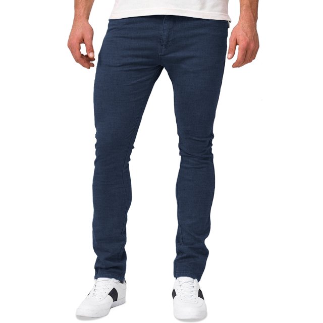 jeans para hombre shendy vendy slim fit mezclilla stretch azul oscuro, vista frontal centrada de piernas en modelo con corte slim ajustado de cadera a tobillo, mezclilla con ligera elasticidad, cierre de cremallera y botón, bolsillos traseros reforzados aptos para teléfono; también usados frecuentemente como prenda cómoda para viajes urbanos.