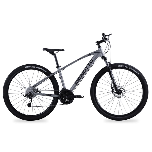 bicicleta benotto montaña fs-950 r29aluminio 27v. gris vista lateral de bicicleta de montaña gris con cuadro de aluminio y logo BENOTTO, horquilla de suspensión, manubrio y potencia de aluminio, asiento ergonómico, frenos de disco dobles mecánicos, transmisión 3x8 (24 velocidades), rines de aluminio doble pared y llantas 29x2.2 sobre fondo blanco; componentes pueden variar según stock, adecuada para rutas todoterreno y uso recreativo.