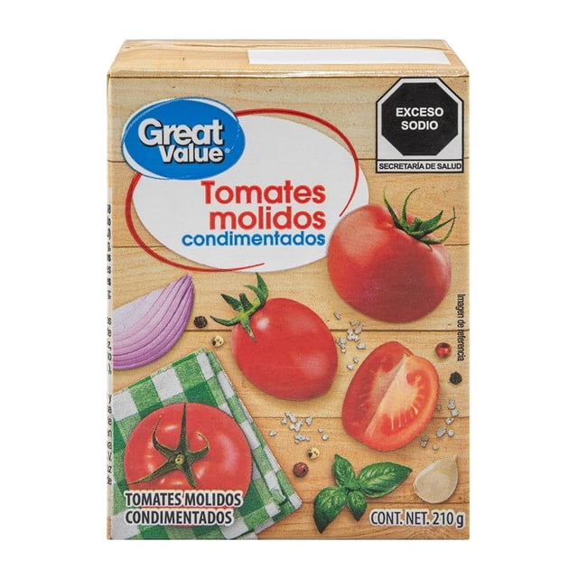 tomates molidos great value condimentados 210 g — Caja frontal con ilustraciones de tomates enteros y rebanado, hoja de albahaca, diente de ajo y rodaja de cebolla sobre tabla de madera; logotipo Great Value y sello 'Exceso Sodio'; listo para usar como base en guisos y salsas, también apto para adobos rápidos.
