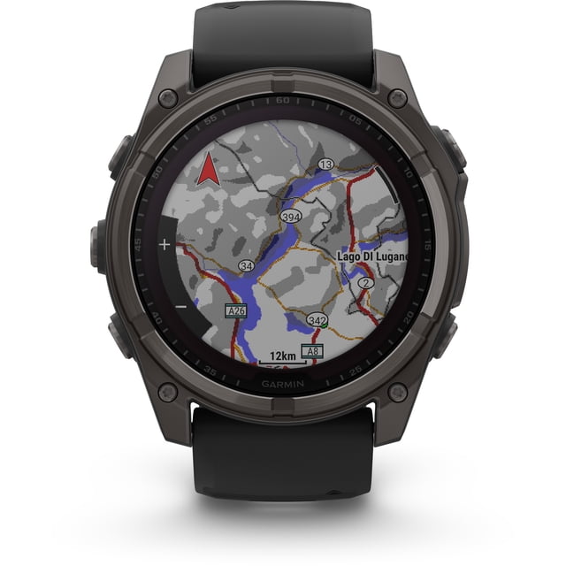 garmin, monitor deportivo, fenix 8, 51mm, sapphire solar, carbon gray reloj inteligente 51 mm en gris carbónico con bisel metálico oscuro y pantalla circular que muestra mapa topográfico; correa negra de silicón, cuatro botones laterales y vista frontal centrada, ideal para entrenamiento multideporte y actividades al aire libre.
