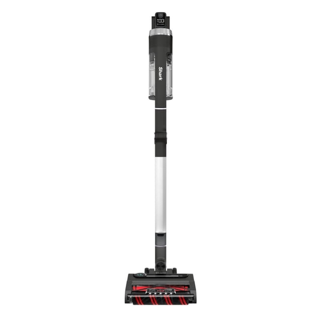 aspiradora shark stratos inalámbrica 309 watts con clean sense iq color gris, vista frontal completa; aspiradora palo sin cable gris con depósito transparente y logo Shark en la empuñadura, tubo plateado, indicador superior, cabezal Duoclean con franjas rojas y cepillo rotatorio visible para alfombras y pisos duros, sistema HairPro para recogida de pelo, diseño ligero y ergonómico, a menudo usada para limpiezas rápidas en áreas de alto tránsito.