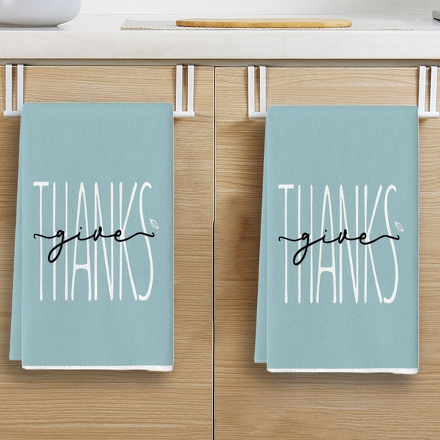 oioii stripes dot pumpkin fall kitchen towels dish towels, 18x26 inch farmhouse maple leaves autumn decoration hand towels(15.8x23.6in) Blue hand towel front-facing folded on a white under-cabinet towel rack, large white vertical 'THANKS' lettering with black cursive 'give' across center, polyester fabric listed in specs, visible top hanging loop, shown against light wood kitchen cabinet; suitable as a seasonal autumn kitchen hand towel or guest hand towel.