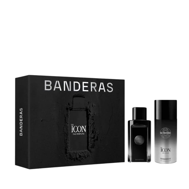 set banderas the icon 2pzs set de regalo con estuche negro, incluye Eau de Parfum 100 ml en botella rectangular de vidrio oscuro y desodorante 150 ml en envase cilíndrico degradado; fragancia amaderada y aromática, presentación moderna y masculina con marca Antonio Banderas visible.