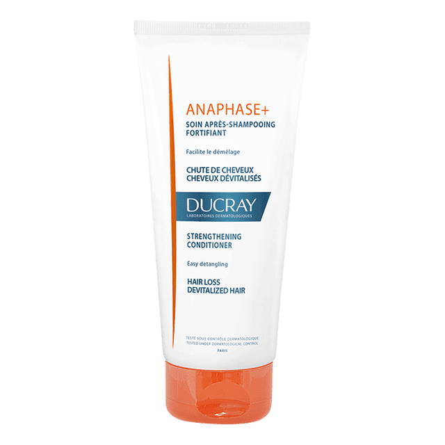 acondicionador anticaída ducray anaphase+ 200ml tubo blanco con tapa naranja, vista frontal centrada; texto naranja y azul 'ANAPHASE+' y logotipo DUCRAY visibles, acondicionador fortalecedor que aporta volumen y facilita el desenredado y peinado. También suele usarse para desenredar extensiones o pelucas.